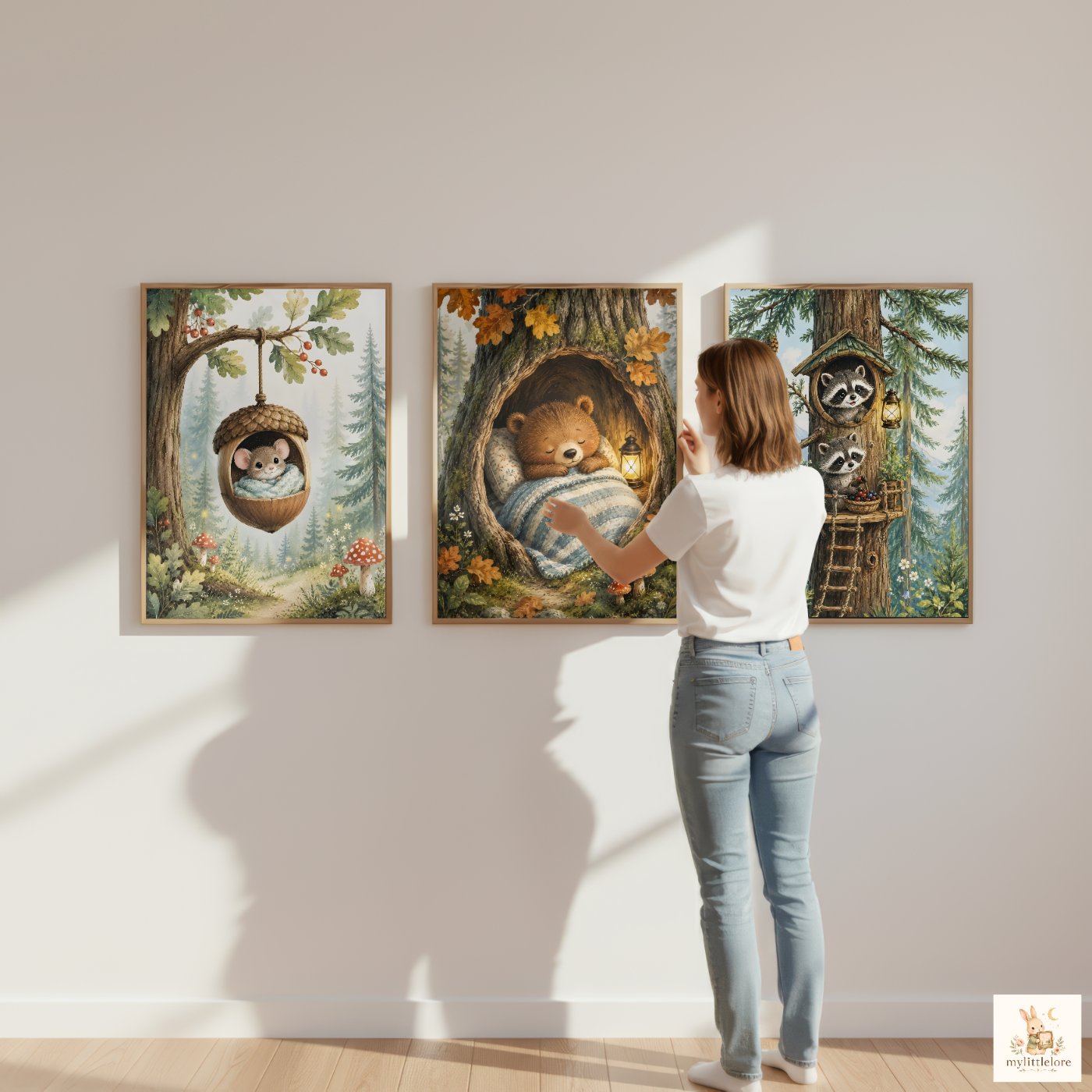 Woodland Stories prints hung together above a child's bed